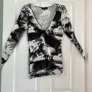 Sexy, fun top . Front does show small amount of cleavage